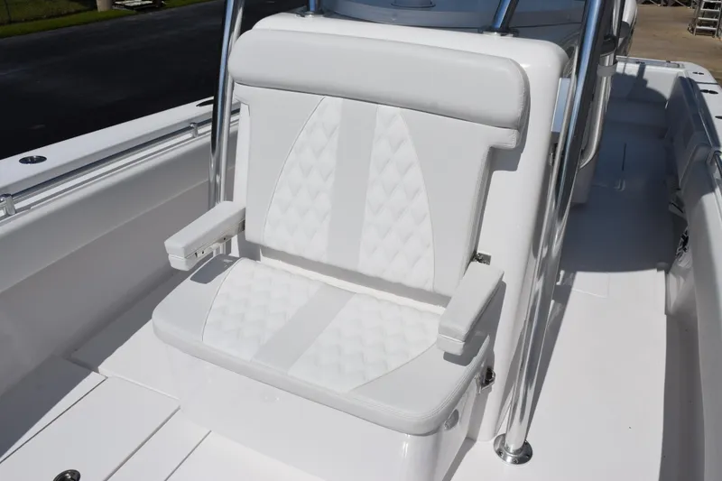 Slide: The Image of White seating on 2026 Contender 32 ST boat, featuring diamond-pattern upholstery. - 16