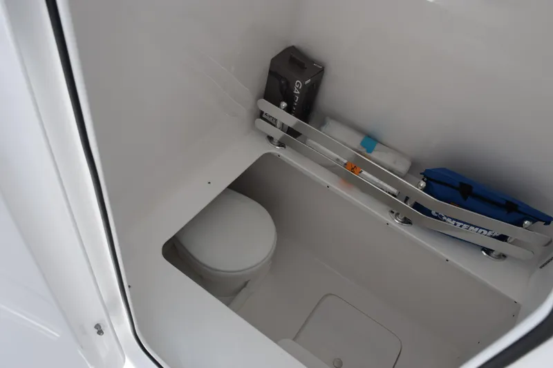 Slide: The Image of Interior of 2026 Contender 32 ST boat showing storage and toilet area. - 19
