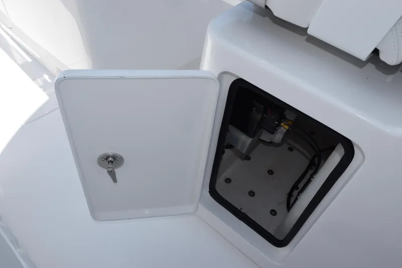 Slide: The Image of Open storage compartment on 2026 Contender 32 ST boat, showing interior details. - 26