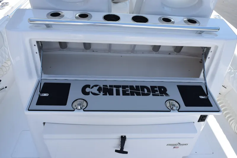 Slide: The Image of 2026 Contender 32 ST boat console with storage and rod holders. - 27