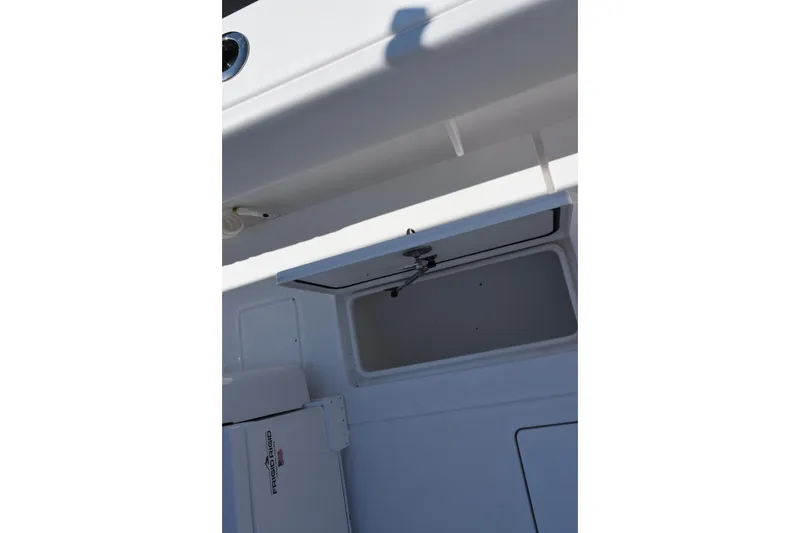 Slide: The Image of 2026 Contender 32 ST boat storage compartment with open hatch. - 29
