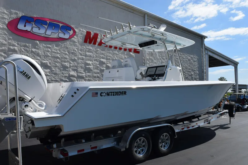 Slide: The Image of 2026 Contender 32 ST boat on trailer at GSPS Marine dealership. - 4