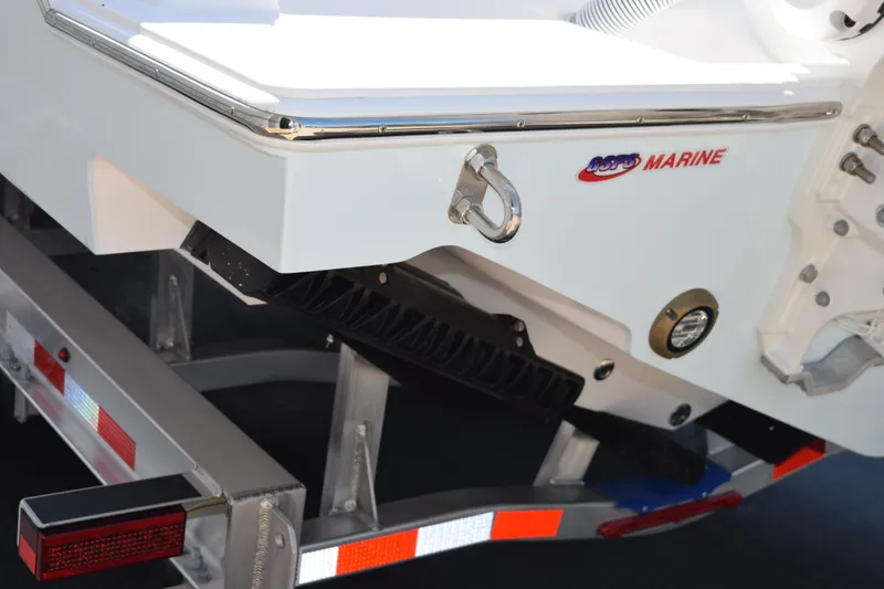 Slide: The Image of 2026 Contender 32 ST boat on trailer, featuring marine hardware and branding. - 7