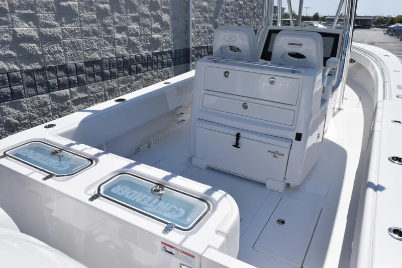 Slide: The Image of 2026 Contender 32 ST boat interior with seating and storage compartments. - 8