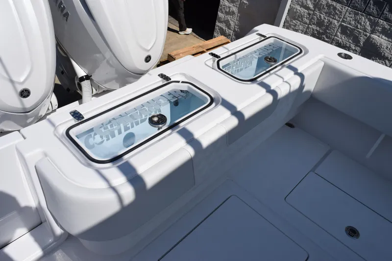 Slide: The Image of 2026 Contender 32 ST boat with dual Yamaha engines and livewell compartments. - 9