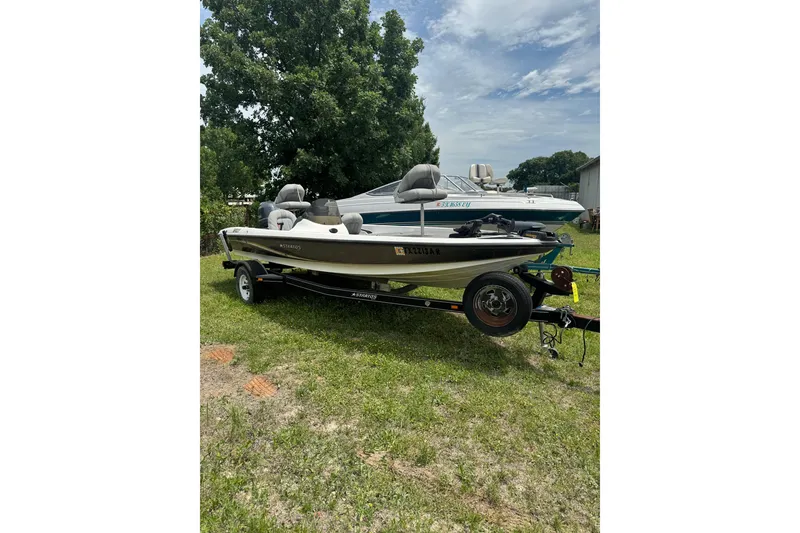 The Image of 2008 Stratos 176 XT boat on trailer, parked on grass under a cloudy sky. - 0