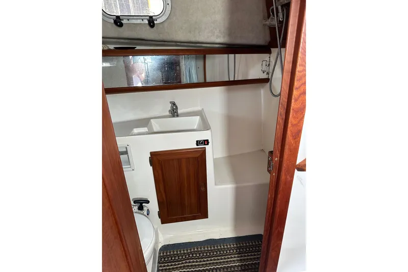 Slide: The Image of Sink, vanity and shower combination. - 15