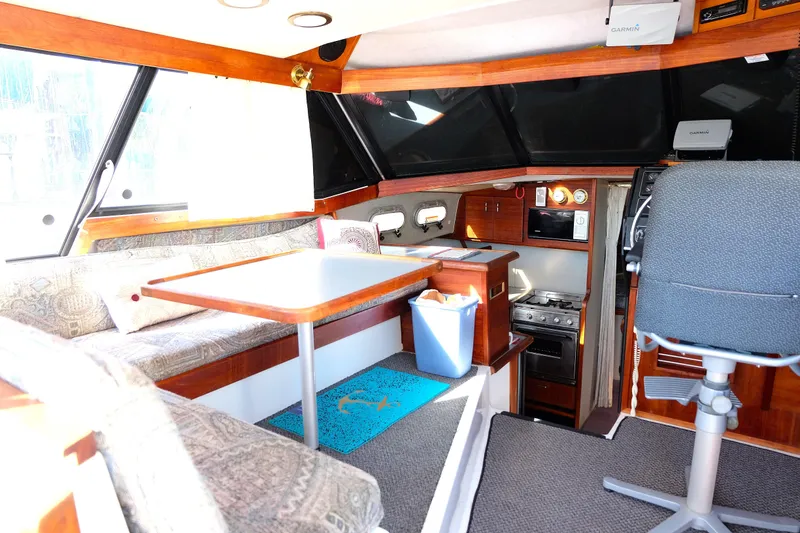 Slide: The Image of Settee and table convert to additional berth. - 6