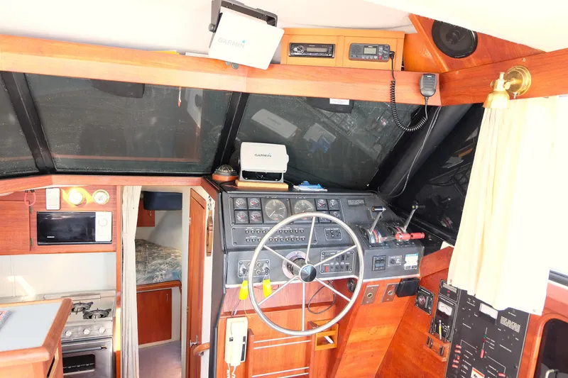 Slide: The Image of Lower helm featuring radar, MFD, VHF radio, lee helm and helm. - 8