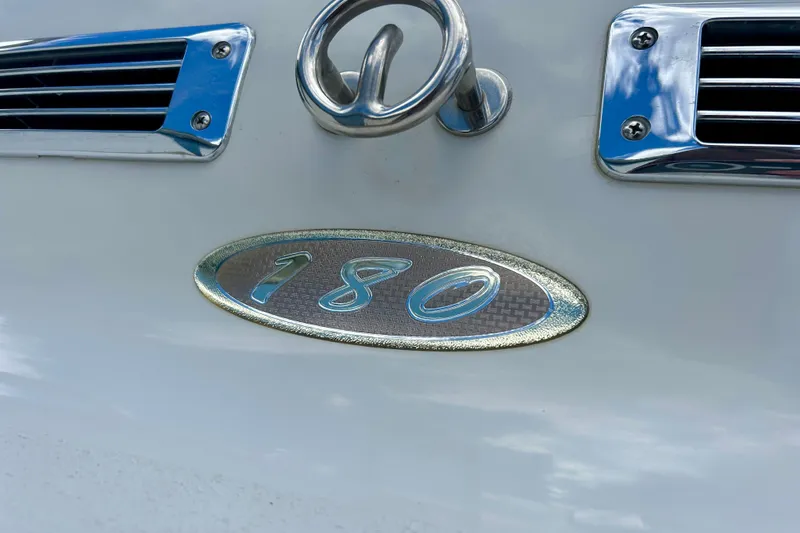 Slide: The Image of Crownline 180 BR 2007 boat emblem with chrome accents and ventilation grilles. - 11