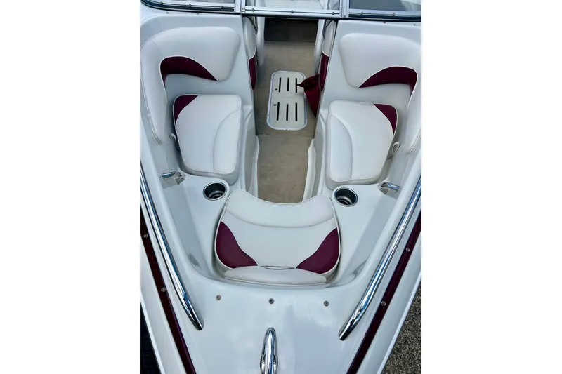Slide: The Image of 2007 Crownline 180 BR boat interior with white and maroon seating. - 12
