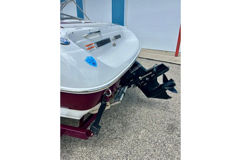 Slide: The Image of 2007 Crownline 180 BR boat rear view with outboard motor and trailer. - 19