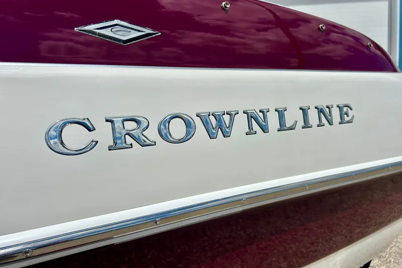 Slide: The Image of 2007 Crownline 180 BR boat with chrome lettering and maroon detailing. - 20