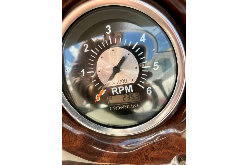 Slide: The Image of Close-up of a 2007 Crownline 180 BR RPM gauge showing 2353 hours. - 24