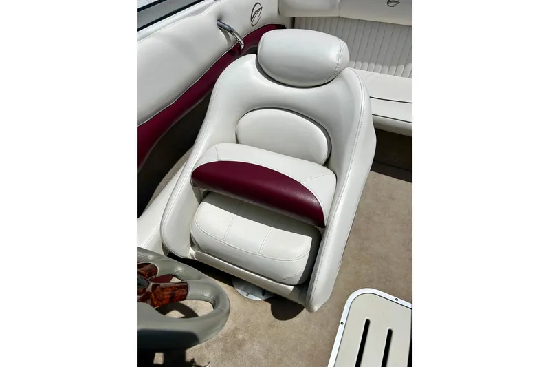 Slide: The Image of 2007 Crownline 180 BR boat interior with white and maroon seating. - 34