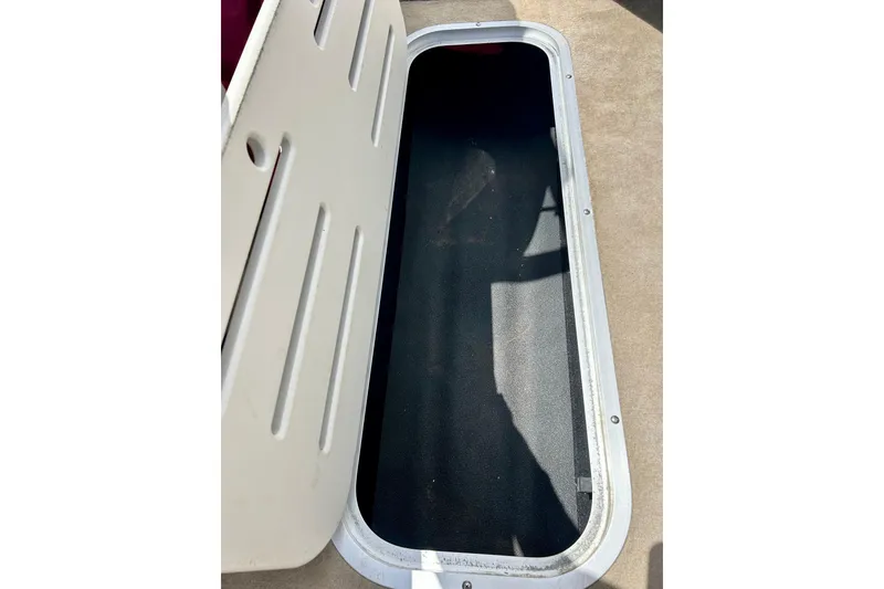 Slide: The Image of Open storage compartment on a 2007 Crownline 180 BR boat. - 37