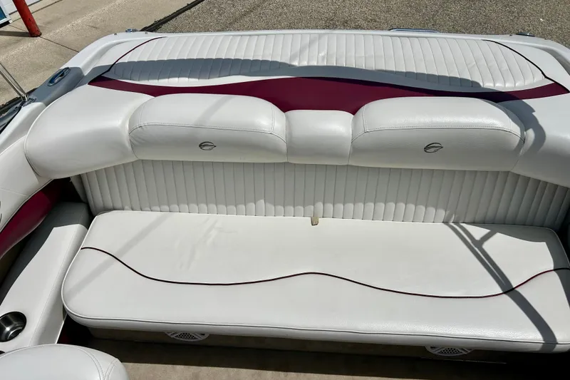 Slide: The Image of 2007 Crownline 180 BR boat interior with white and maroon seating. - 38