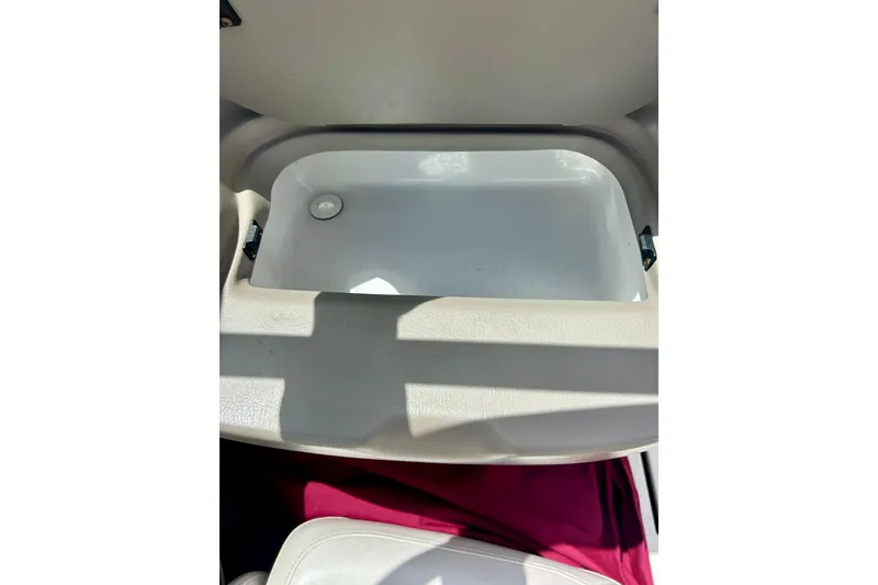 Slide: The Image of Open storage compartment in a 2007 Crownline 180 BR boat interior. - 43