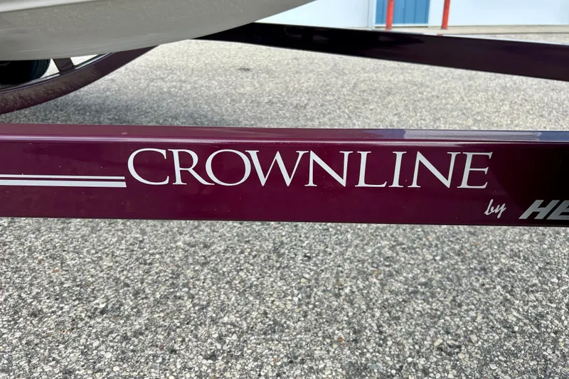 Slide: The Image of Trailer with "Crownline" branding, 2007 Crownline 180 BR boat model. - 5