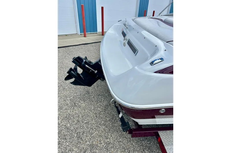 Slide: The Image of Rear view of a 2007 Crownline 180 BR boat on a trailer. - 9