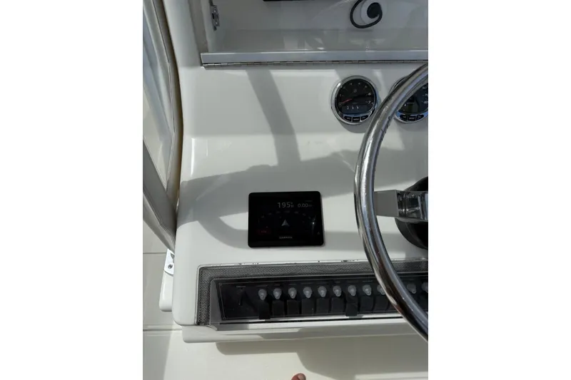 Slide: The Image of Dashboard of a 2014 SeaVee 290B boat with steering wheel and gauges. - 3