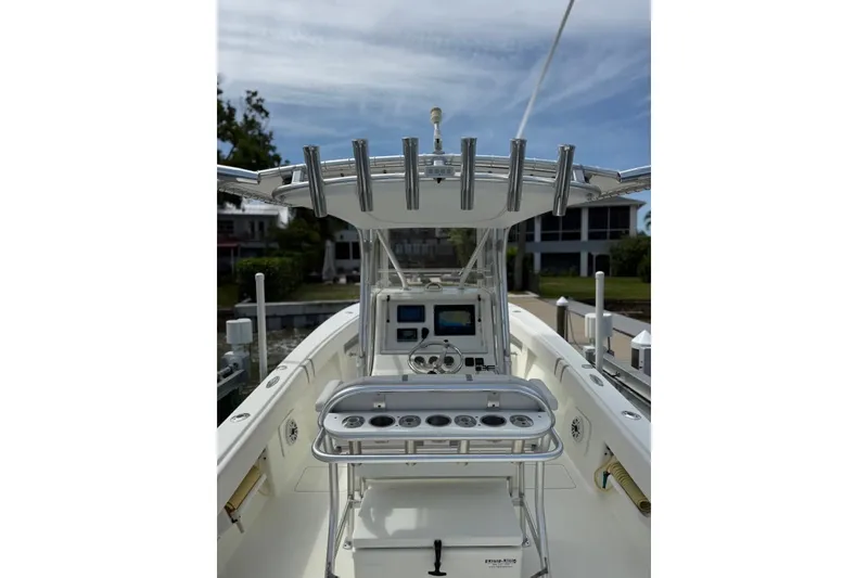 Slide: The Image of 2014 SeaVee 290B boat cockpit with fishing rod holders and navigation equipment. - 6