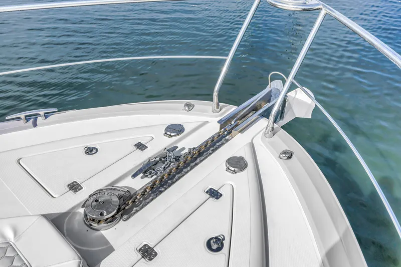Slide: The Image of Bow of 2009 Marquis 500 Sport Bridge yacht with anchor chain and railing. - 14