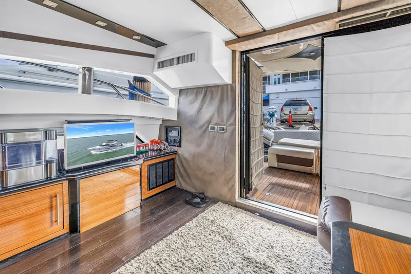 Slide: The Image of Luxurious interior of 2009 Marquis 500 Sport Bridge yacht with modern amenities and open deck view. - 23