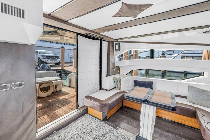 Slide: The Image of Luxurious interior of 2009 Marquis 500 Sport Bridge yacht with modern seating and waterfront view. - 26