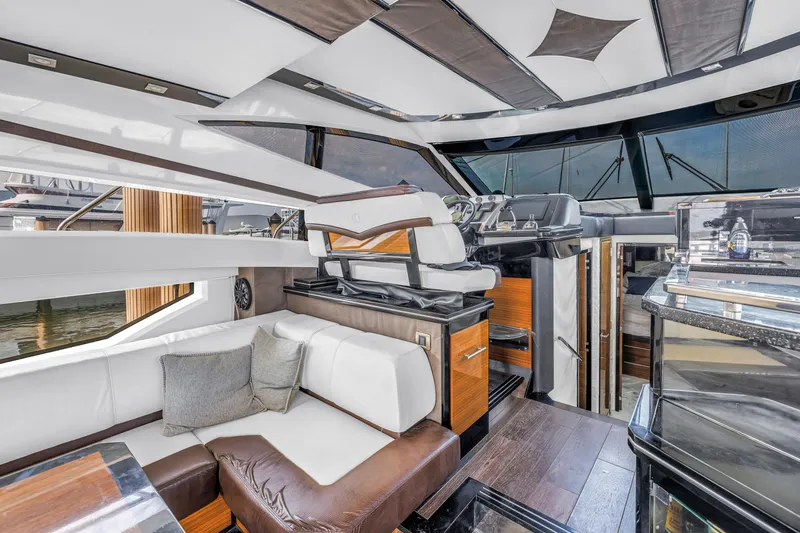 Slide: The Image of Luxurious interior of 2009 Marquis 500 Sport Bridge yacht with modern seating and helm. - 27