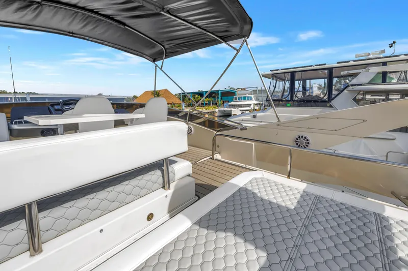 Slide: The Image of Luxurious 2009 Marquis 500 Sport Bridge yacht with spacious deck and seating area. - 32