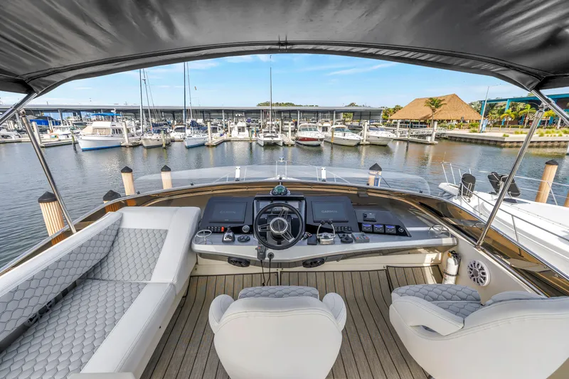Slide: The Image of Luxurious 2009 Marquis 500 Sport Bridge yacht interior with marina view. - 38