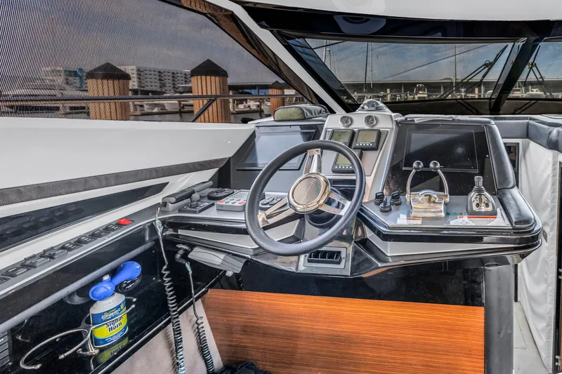 Slide: The Image of Helm of 2009 Marquis 500 Sport Bridge yacht with advanced controls and navigation systems. - 41