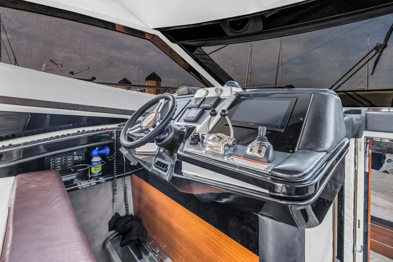 Slide: The Image of Interior helm of 2009 Marquis 500 Sport Bridge yacht with modern controls and steering wheel. - 42
