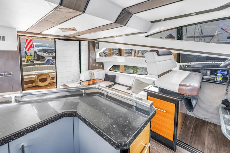 Slide: The Image of Luxurious interior of 2009 Marquis 500 Sport Bridge yacht with modern seating and sleek design. - 43