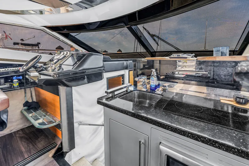 Slide: The Image of Interior of 2009 Marquis 500 Sport Bridge yacht with modern kitchen and helm station. - 44