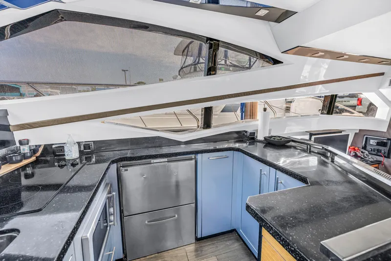 Slide: The Image of Luxurious 2009 Marquis 500 Sport Bridge yacht kitchen with modern appliances and sleek design. - 46