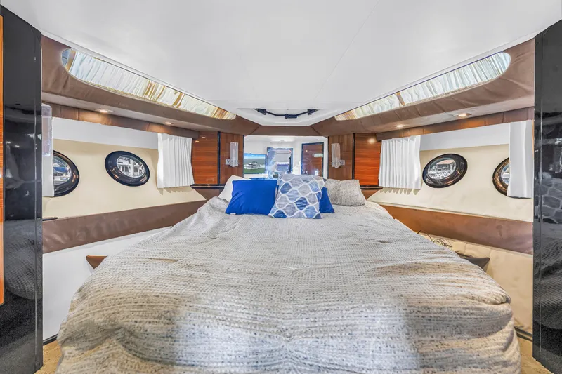 Slide: The Image of Luxurious cabin interior of 2009 Marquis 500 Sport Bridge yacht with plush bedding. - 47
