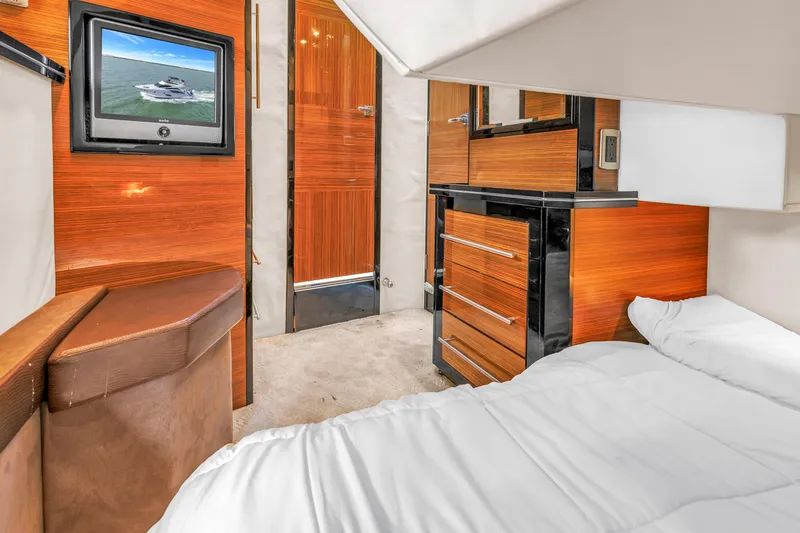 Slide: The Image of Luxurious cabin interior of 2009 Marquis 500 Sport Bridge yacht with modern wood finishes. - 48