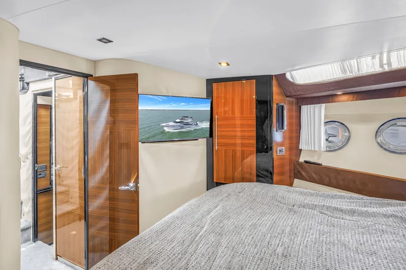 Slide: The Image of Luxurious interior of 2009 Marquis 500 Sport Bridge yacht with modern wood finishes. - 49