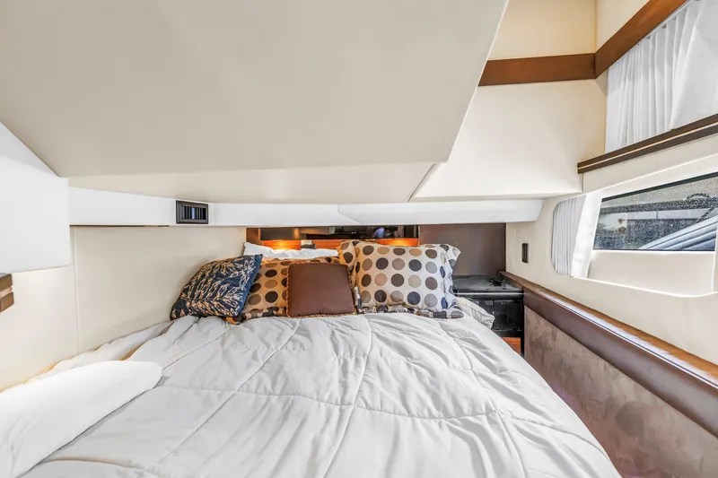 Slide: The Image of Luxurious cabin interior of 2009 Marquis 500 Sport Bridge yacht with cozy bedding. - 53