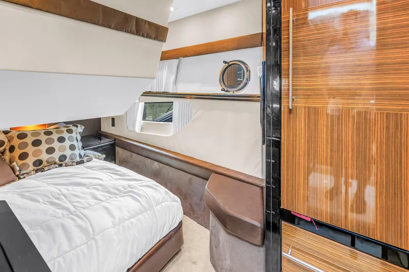 Slide: The Image of Luxurious cabin interior of 2009 Marquis 500 Sport Bridge yacht with modern wood finishes. - 55