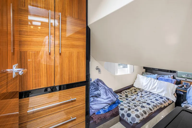 Slide: The Image of Luxurious cabin interior of 2009 Marquis 500 Sport Bridge yacht with cozy bedding. - 56