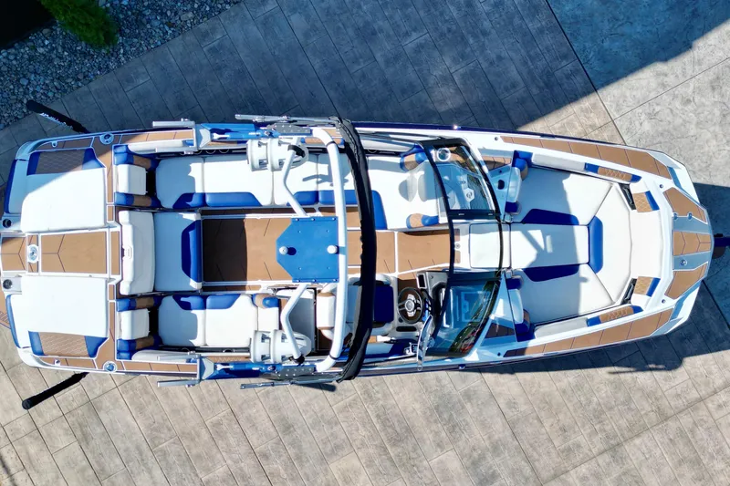 Slide: The Image of Overhead view of a 2022 Malibu M240 boat with sleek design and spacious seating. - 15
