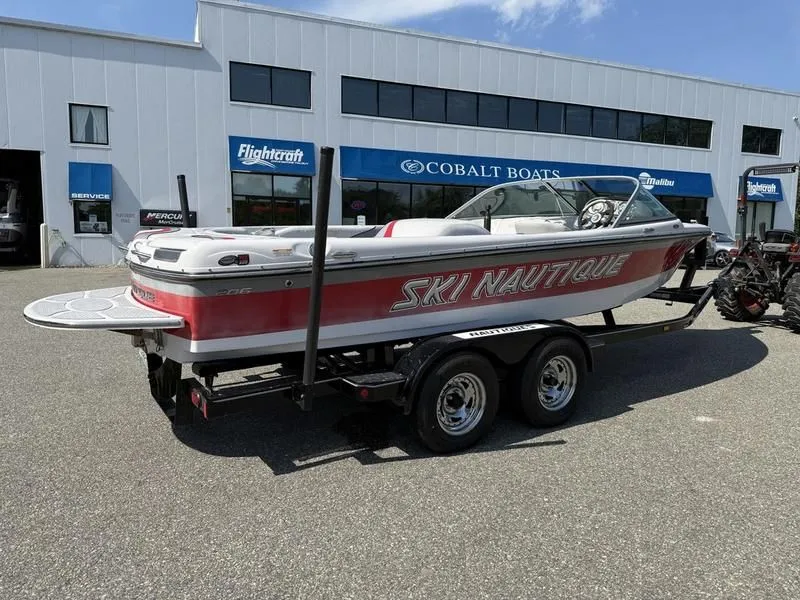 Slide: The Image of 2008 Nautique Ski Nautique 206 boat on trailer outside boat dealership. - 10