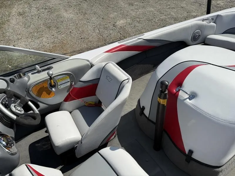 Slide: The Image of Interior of a 2008 Nautique Ski Nautique 206 boat with red accents. - 11