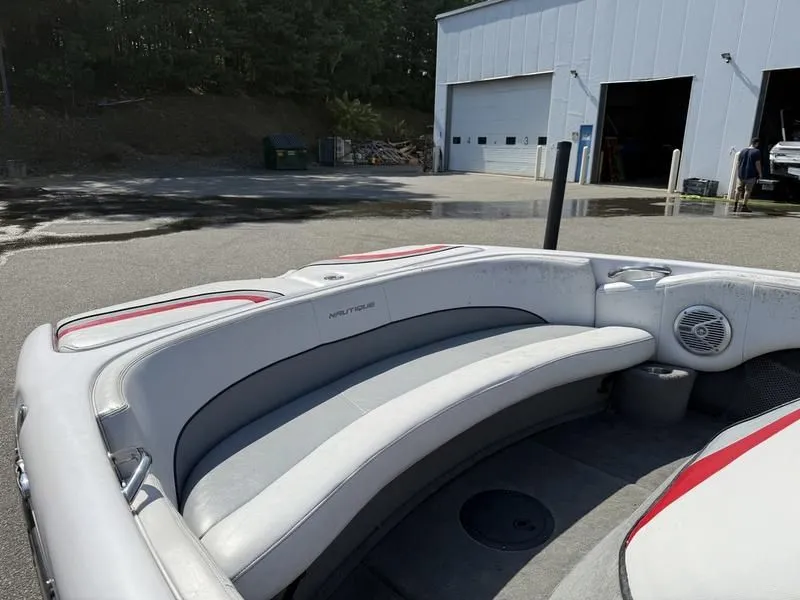 Slide: The Image of 2008 Nautique Ski Nautique 206 boat with gray seating outdoors. - 12