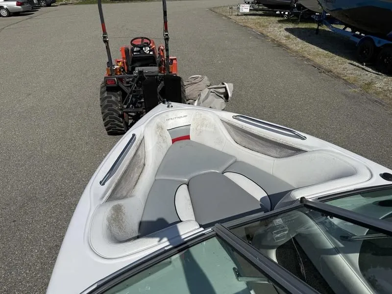 Slide: The Image of 2008 Nautique Ski Nautique 206 boat with tractor in background. - 15