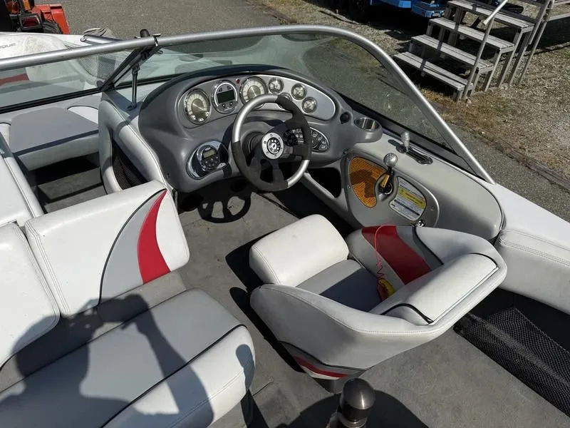 Slide: The Image of Interior of a 2008 Nautique Ski Nautique 206 boat with steering console. - 16