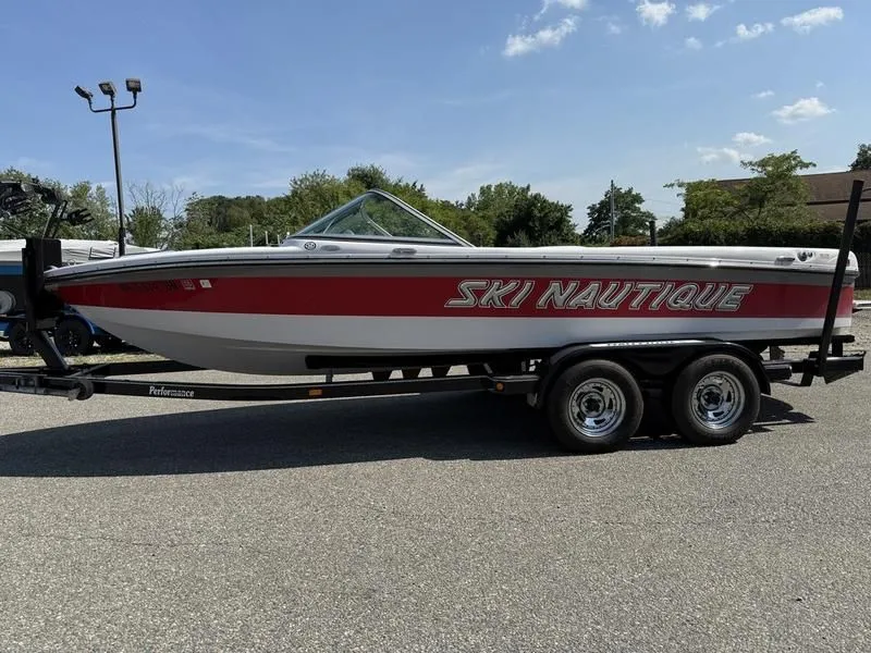 Slide: The Image of 2008 Nautique Ski Nautique 206 boat on trailer outdoors. - 4